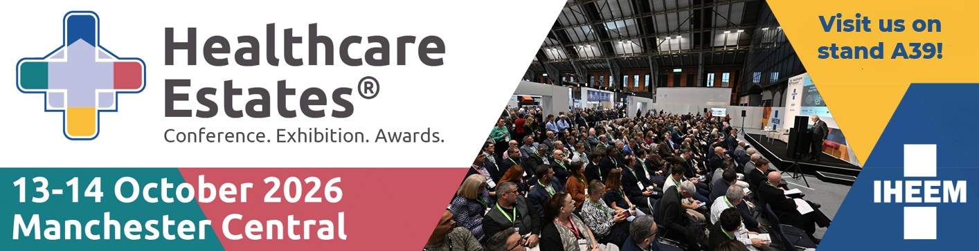 Healthcare Estates banner showing logo, dates 13–14 October 2026, Manchester Central, and a crowded exhibition hall with attendees.