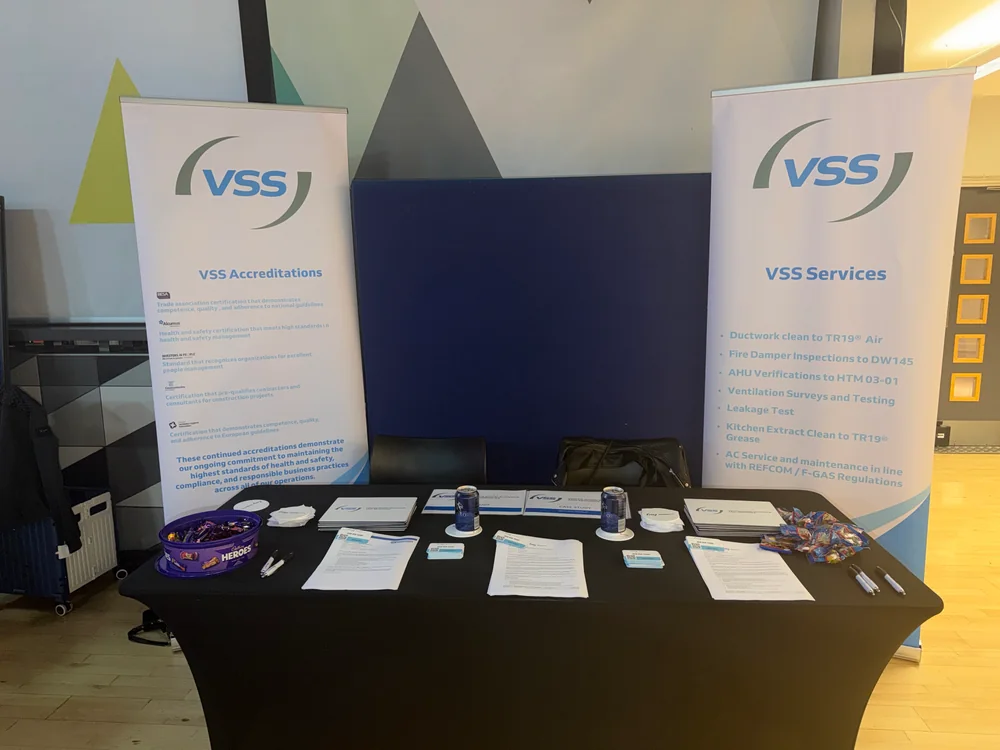 VSS exhibition stand at the University of Liverpool Job Fair, with accreditation and services banners and recruitment leaflets on the table